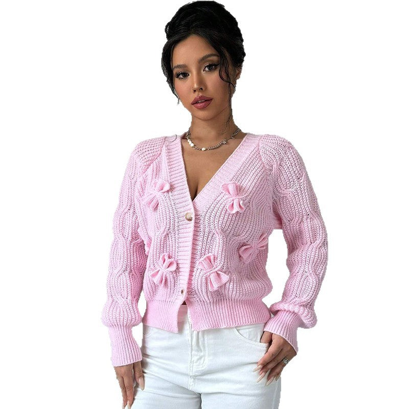 Solid color long sleeved bow sweater for women