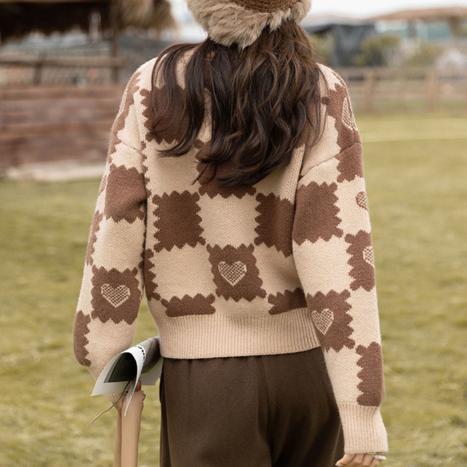 Loose fitting design with a pink knit sweater