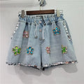 Denim shorts with Flower set with diamonds details elastic high waist loose fit and slimming effect