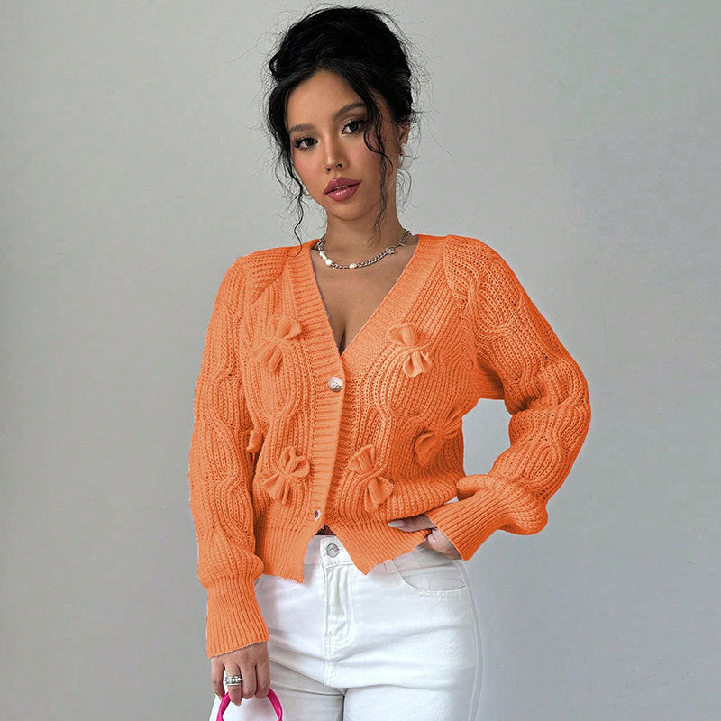 Solid color long sleeved bow sweater for women