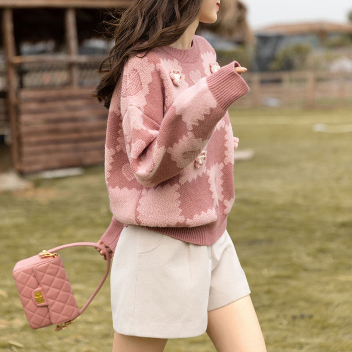 Loose fitting design with a pink knit sweater